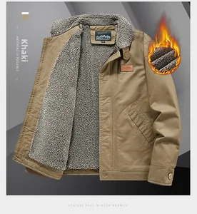 Detail of khaki jacket showing warm lamb wool lining and leather brand patch on chest