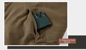 Detail showing the slant side pocket of N1 deck jacket with a smartphone for scale