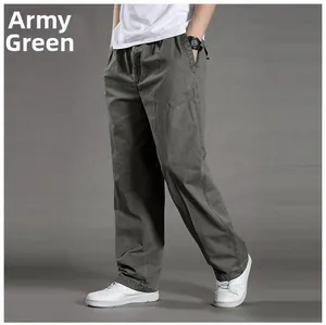 Detail view of army green cotton cargo pants with elastic drawstring waist and side pockets