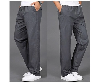 Detail of grey casual pants showing the comfortable elastic waistband and side pockets