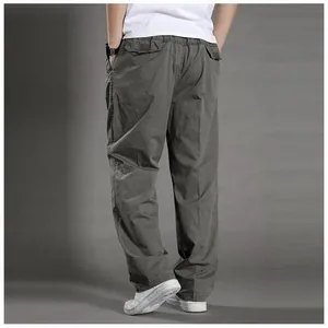 Detail of cargo pockets and cotton twill fabric on men's relaxed fit straight leg pants