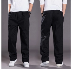 Detailed front and back view of men's black loose casual pants with elastic waistband
