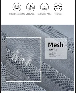 Macro shot of breathable mesh fabric showing the gray polyester structure for quick dry vests