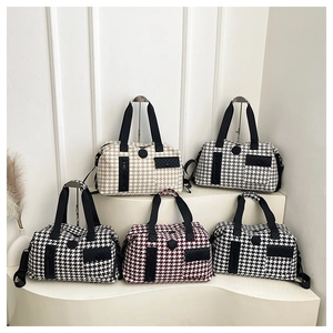 Detail of houndspurth travel bags in beige, grey, black, burgundy, and navy colors