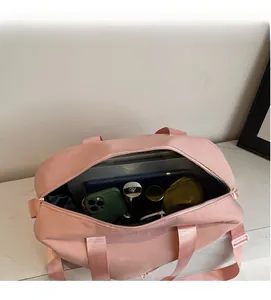 Spacious interior of pink travel bag showing organized storage for gadgets and cosmetics