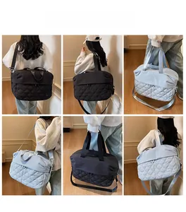 Versatile large travel bag in black and light blue showing various carrying styles