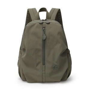Detail of army green nylon backpack showing central vertical zipper and metal MS logo