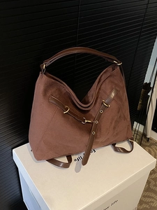 Brown matte suede tote bag with metal rings and versatile convertible backpack straps