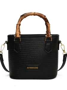 Black woven bucket bag with bamboo top handle and golden hardware for summer
