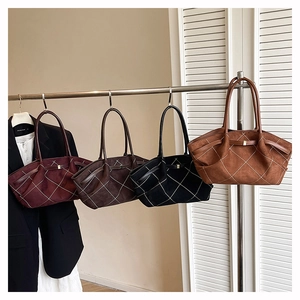 Detail of four large tote bags in burgundy, coffee, black, and brown with diamond stitching
