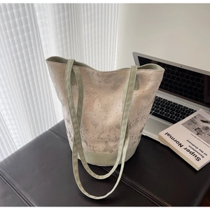 Detail of silver butterfly jacquard canvas tote bag with subtle rhinestone decorations