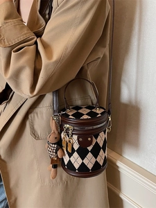 Vintage quilted barrel bag in beige and black leather with plush rabbit charm