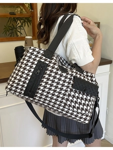 Large houndstooth travel bag with crossbody strap and multi-pocket design for fitness
