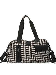 Classic houndstooth large capacity travel bag with black straps and adjustable shoulder belt