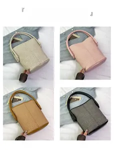 Detail view of woven bucket bags in cream, pink, brown, and black colors