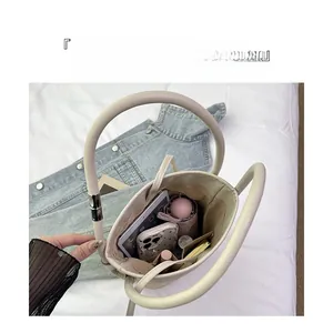 Top view of woven tote bag interior showing large capacity for tablet and daily items