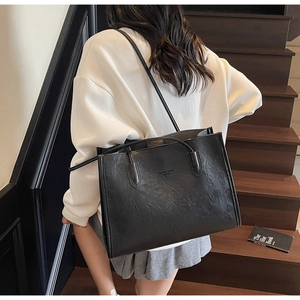 Fashion Trend WMTS large tote bag in black textured leather shown from a rear side view