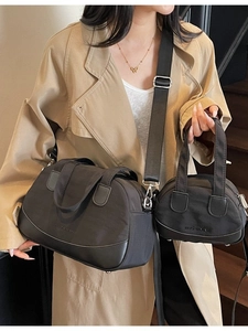 Women's black fabric shell bag set with adjustable shoulder strap and leather trim