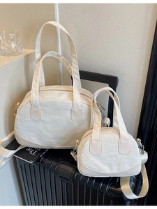 Chic beige shell-shaped shoulder bag set with top handles and adjustable strap