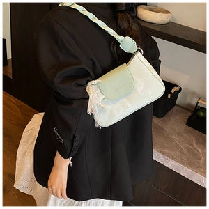 Detail of mint green marble pattern shoulder bag with woven strap and pearl lace charm