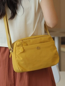 Fashionable bright yellow nylon crossbody bag with multi-layer zipper pockets for women