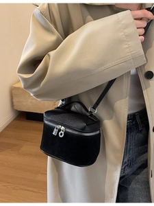 Fashionable black mini box crossbody bag featuring mixed lychee leather and suede textures