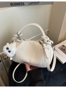White pleated dumpling handbag with adjustable strap and cute ghost pendant