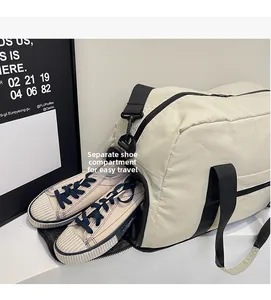 Detail of multi-functional travel bag featuring a dedicated side shoe compartment