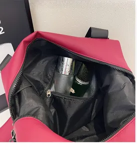 Detail showing red travel bag waterproof dry and wet separation interior compartment