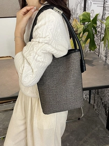 Fashion woven bucket bag in black and white knit with leather strap for women