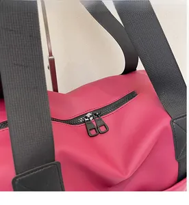 Close-up of durable rose red travel backpack featuring smooth double metal zippers