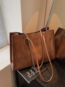 Brown vintage faux leather tote bag with long handles for daily work and commuting