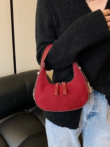 Chic red suede half-moon hobo bag styled as an underarm shoulder bag for women