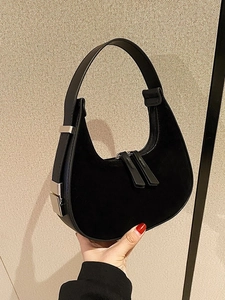 Retro black suede hobo shoulder bag with moon-shaped design and silver buckles
