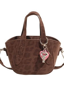 Vintage leopard print handbag for women with pink heart charm and brown suede finish