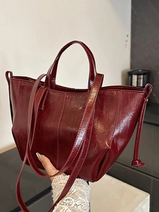 Vintage burgundy faux leather tote bag with glossy finish and detachable shoulder strap