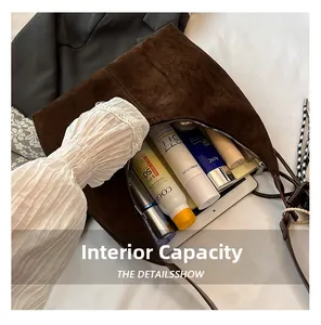 Detailed interior of vintage brown suede tote bag showing large capacity for essentials