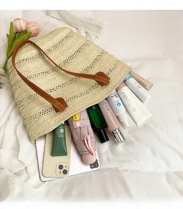 Detail view of large beige woven tote bag interior showing spacious storage for daily items