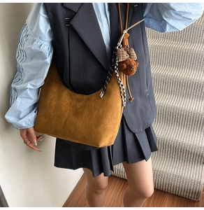 Retro brown suede shoulder bag with cute plush bear pendant and plaid ribbon detail