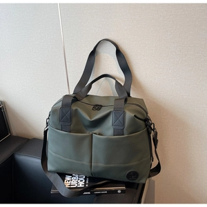 Macro detail of olive green large capacity backpack with waterproof nylon texture