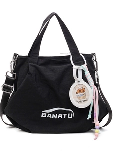 Black canvas bucket bag with BANATU logo and Capybara charm, dual straps and zip closure