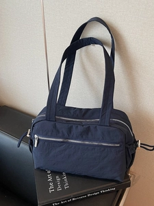 Minimalist large capacity dark blue nylon tote bag with silver zipper and shoulder straps