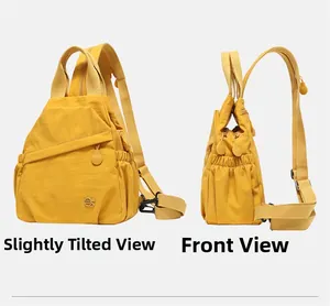 Detail view of the yellow nylon functional backpack showing front and side storage compartments