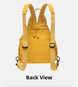 Back view of yellow nylon backpack showing adjustable straps and rear zipper pocket