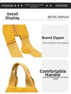 Detailed macro view of durable smooth zipper and thick webbing handle on yellow backpack