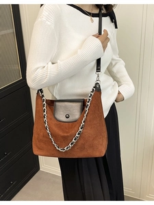Brown suede tote bag with black leather flap and decorative chain strap for women
