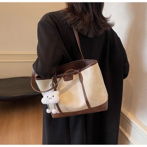 Retro cream and brown contrast tote bag with plush cloud charm shown on model