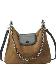 Brown suede hobo tote bag with black leather flap and silver chain shoulder strap