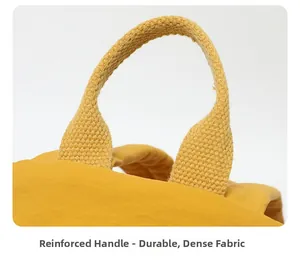 Détail de la poignée en tissu jaune renforcé avec tissage haute densité durable