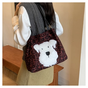 Detailed back view of a large leopard print tote bag with a white plush dog embroidery
